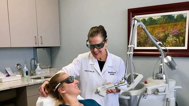 Dr. Cornelius using the halo hybrid fractional laser with a patient